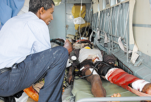 A doctor treating one of the Rusizi earthquake victims in a helicopter that evacuated many to various hospitals. (Photo/ G. Barya)