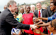 ABOVE, the visiting president greets youth at Kimisagara youth centre.