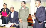 Gen. Nzaramba (in military fatigue), his wife Kayitetsi (L), Nzarambau2019s lawyer Rutabingwa (right) and the plaintiffu2019s counsel Mutembe at the Military Tribunal in Remera yesterday. (Photo /G. Barya)