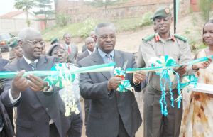 Gen. Marcel Gatsinzi (C) flanked by Military Chief of General Staff Gen. James Kabarebe (R) and Housing Bank Director Gervais Ntaganda during the official of the military housing scheme. (Photo J Mbanda)