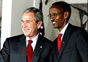 Kagame  and Bush shake hands after signing an investment treaty at Village Urugwiro yesterday. (PPU photo)