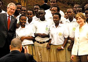 President Bush and Mrs. Laura Bush pose for a photo with Lycu00e9e de Kigali students on Tuesday in Kigali. (PPU Photo)