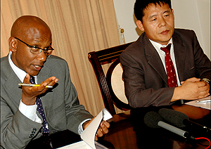 Dr David Himbara and Kwon-Hyoung Nam addressing journalists after signing the u2018Record of Discussionu2019 papers yesterday at Village Urugwiro. (Photo/J. Mbanda)