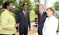 Presidents Kagame and Bush with their wives, Jeannette and Laura, during a chat at Village Urugwiro on Tuesday. (Courtesy photo)