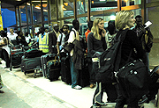 Passengers at Kigali International Airport. Many say the new policy is inconveniencing. (File photo)