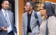 L-R Aimble Mwananawe,   Rwanda HIV Forum chairman , Titus James Mwesige and Myra Dangana Deya from Eannaso.( Photo/ I. SSuuna)