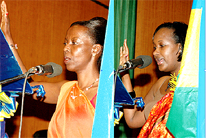 TAKING THE OATH: Ministers Mushikiwabo (L) of Information and Bihire of Infrastructure swear in yesterday at Parliamentary Buildings, Kimihurura. (Photo / G. Barya)