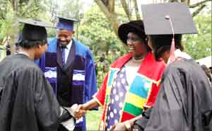 CONGRATULATIONS: Dr Gahakwa (2nd right) congratulates one of the graduands; looking on is Dr Ndushabandi (2nd left) yesterday at Jali Club. ( Photo / J. Mbanda)