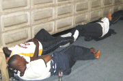 AMID CHAOS: Rayon Sports Players take a nap at Jomo Kenyatta international Airport awaiting their flight to Khartoum on Friday night. (Photo/Uwigenga Christian)