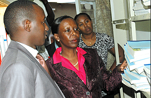 Information Minister Louise Mushikiwabo (C) at the High Council of the Press library in company of the councilu2019s Executive Secretary Patrice Mulama (L) and the Ag. president and Secretary, Thais Ruboneka. (Photo / J.Mbanda)