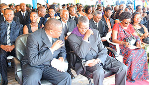 IBUKA president Thu00e9odore Simburudali (with a purple scarf) and several officials during the 14th Genocide commemoration function in Bugesera on Monday. (PPU photo).