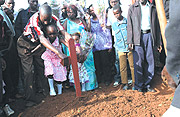 Mourners during the burial of the late Police Constable Munyantamati in Masaka, a city.