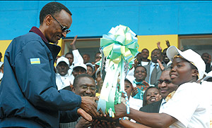 President Kagame receives a trophy from teachers in recognition of his unwavering support to the countryu2019s education sector. (Photo/G. Barya).