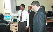 L-R: The New Timesu2019 Editor David Gusongoirye, Managing Director Joseph Bideri, Ambassador Cannon and Laurie Hunte, a British Embassy official in  the newspaperu2019s newsroom yesterday. (Photo / J. Mbanda).