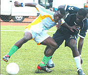 IAM BETTER: Atracou2019s Peter Kagabo shields the ball from APRu2019s defender Aloua Gaseruka yesterday at Nyamirambo stadium. (Photo/ G.Barya).