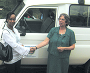 Rotary Club President Sonia Mukamana hands over keys to CHABA Executive director Dr.Susanna Grannis. (Photo by Dan Ngabonziza).