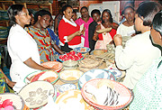 Women displaying baskets at Gahaya Links.