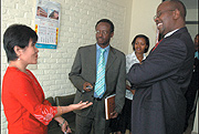 Finance Minister James Musoni talks to Marzan Chita the Finance and Administration Adviser in the UNDP NISR Support Project, during his visit to the NISR on Wednesday. (Photo/ J. Mbanda).