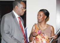 Alfred Ndahiro chatting with Louise Mushikiwabo at Kigali Serena Hotel yesterday. (Photo / G. Barya)