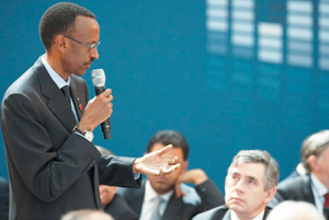 President Paul Kagame addressing the Call to Action Event in London as British Premier Gordon Brown listens attentively.(PPU photo)
