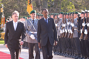 President Paul Kagame inspecting a guard of honour on arrival in Germany. He is accompanied by German President  Horst Koehler. (File photo).