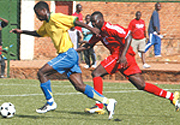 Elias Uzamukunda goes past Sudan defender yesterday at Nyamirambo stadium.His lone goal was not enough to help Amavubi reach CHANu2019s second round. (Photo/E.Mucunguzi).