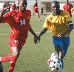 Amavubiu2019s captain Ismali Nshutinamagara beats a Sudanese striker to the ball during the CHAN game on Saturday. (Photo/ E. Mucunguzi)
