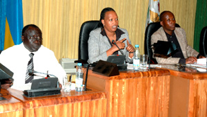 The minister of justice Tharacisse Karugarama (L),Provindence Umurungi talking on International criminal charges(C) and Jean Damascene Bizimana at the parliament in Kimihurura yesterday. (Photo / G. Barya)