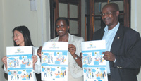 (L-R) Tse Karen Country executive officer I.B.J, Jacqueline Bakamurera assistant attorney General and Gatera Gashabana president of the Kigali bar association displaying  posters during the launch of the international Bridges to justice  yesterday.(photo