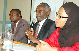 NEC chief Prof. Karangwa addressing journalists at Alpha Palace Hotel yesterday, while his deputy, Fatou Harelimana (R) and commissioner Charles Uyisenga look on. (Photo/G. Barya).