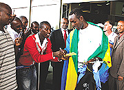 Amavubiu2019s captain Olivier Karekezi signs an autograph on arrival at Kigali International Airport yesterday. Rwanda won away from home, beating Ethiopia 2-1 on Sunday. (Photo E. Mucunguzi).