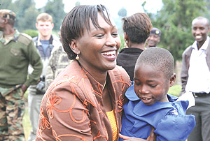 ORTPNu2019s Director General, Chantal Rugamba, hugging a school girl at Nyabitsinde Primary School in Kinigi Sector, Musanze District. (Courtesy photo).