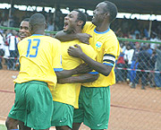 Amavubiu2019s Said Abedi Makasi (c) is mobbed by teammates after scoring the opening goal against Morocco yesterday. Rwanda won 3-1. (Photo/ G. Barya).