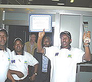 Eugu00e8ne Barikana, Secretary General of MINALOC displaying the UN trophy (Photo / G. Ntagungira)