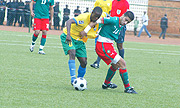 Amavubi midfielder Haruna Niyonzima against a Moroccan opponent in Kigali. Rwanda won 3-1.