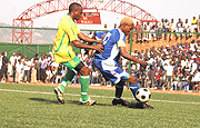 NO WAY: Rayon Sport captain Jean Lomami was completely marked out of the game on Tuesday by Atracou2019s Tom Ssemwogere. Atraco beat Rayon 2-1 to set up a meeting with APR in tomorrowu2019s Peace Cup final. (Photo / G. Barya).