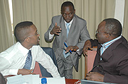 Rwanda Journalistsu2019 Association president Gaspard Safari (C) talks to International Federation of Journalists Director Gabriel Ayite Baglo (R) and Secretary General of EAJA Omar Faruk Osman. (Photo / J. Mbanda).