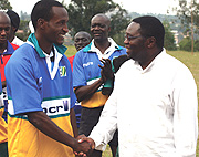 BCR MD David Kuwana shares a light moment with a BCR dressed rugby player. (Photo: E. Mucunguzi).