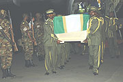Fare thee well: RDF soldiers carry the casket of one of five of their fallen comrades killed in Darfur last week. (Photo/ G.Barya)