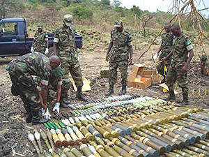 RDF officers arranging ammunition and unexploded ordinances  to be burnt. (Photo/ E Mwesigye)