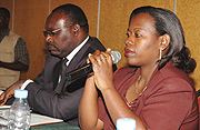 The Governor of BNR, Francis Kanimba (L) listens while MINICOM Minister Monique Nsanzabaganwa (R) responds on the rising Insurance rates. (Photo G.Barya).