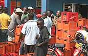 Retailers queue to buy sodas and beers. (Photo/J.Mbanda).