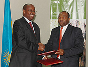 Finance and Economic Planning Minister James Musoni and IFC Director for East and Southern Africa Jean Philipe Prosper after signing MoU at MINECOFIN offices (Photo/ G.Barya)