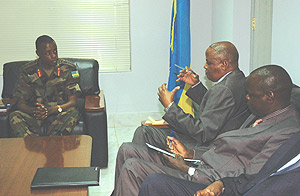 CGS Gen. James Kabarebe (L) with the Dean of Defence Liaison Officer Col. DT  Matiku (C) and Brig .Gen. Fred Tolit at the Ministry of Defence offices at Kimihurura yesterday. (Photo/G. Barya).