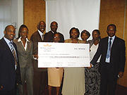 Vincent Karega the Minister of State in charge of Industry and Investment promotion (extreme right) receives BATu2019s contribution. (Courtesy photo)