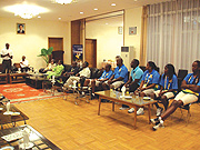 The Minister of Sports and Culture Joseph Habineza (standing), ambassador Ben Rugangazi (seated left) addressing athletes on Saturday at the Rwandan embassy in Beijing, China. (Photo/ B. Mugabe)