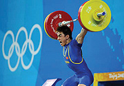 Liao Hui takes a snatch lift to win the 13th gold medal for the hosts yesterday.