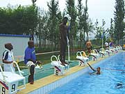 READY: Jackson Niyomugabo receiving final guidelines from his coach Richard Ramira (holding chronometer) in Tuesdayu2019s final training session. (Photo/ B. Mugabe)