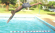 Rwandau2019s Olympian swimmer Jackson Niyomugabo takes a dive during the Beijing Olympic Games preparations at the Novotel hotel pool. (File photo).