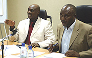 The Director of the Taxpayer Services Department, Gerard Nkusi Mukubu (L) addressing the workshop while the Commissioner for Domestic Taxes, Pierre Celestin Bumbakare looks on. ( Photo/G.Barya).